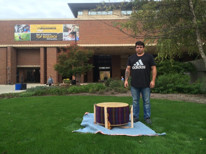 Nathon Breu with the Drum he shares with UWM students.jpg